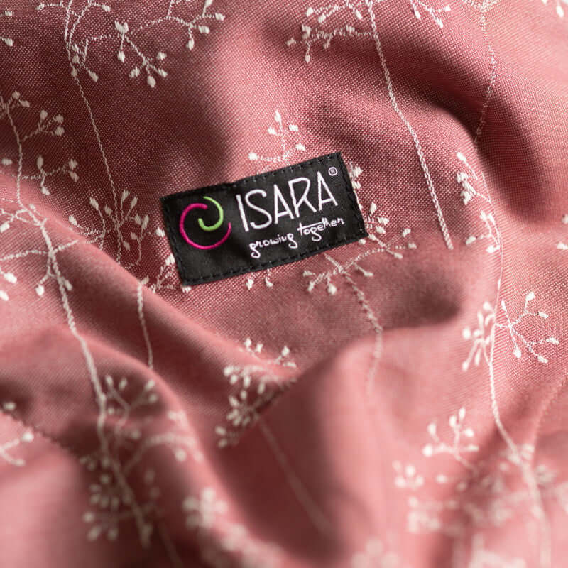 Isara The One - Meadow Grass baby carrier label close-up with floral design | Babymaxi