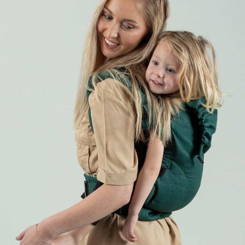 Isara The One - Evergreen Linen baby carrier in use, comfortably carrying a toddler | Babymaxi