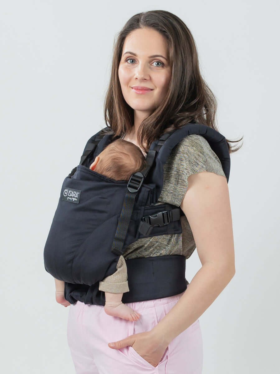 Isara The One - Noire ergonomic baby carrier with a parent carrying an infant comfortably | Babymaxi