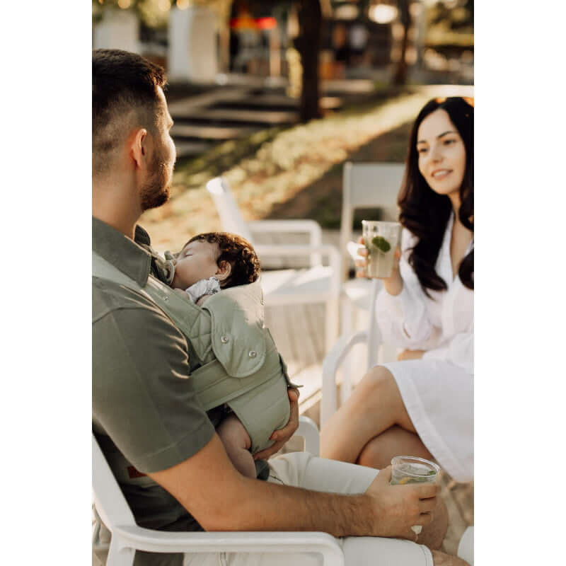 Marsupi Breeze - Pistachio baby carrier used by parents enjoying a sunny day outdoors with their baby | Babymaxi