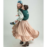 Isara Preschooler (up to 30kg) - Evergreen Linen baby carrier used by a mother with child on her back | Babymaxi