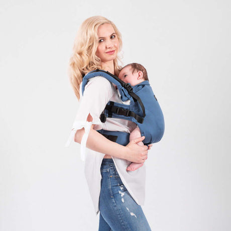 Isara The One - Bluestone ergonomic baby carrier worn by a parent with a baby, showcasing comfort and style | Babymaxi