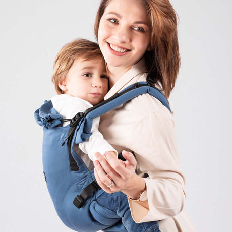 Isara The One - Bluestone ergonomic baby carrier with mother comfortably holding child | Babymaxi