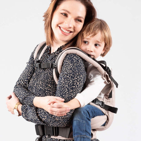 Isara The One - Caffe Latte baby carrier in use, ergonomic design for comfort with child, perfect for all adventures | Babymaxi