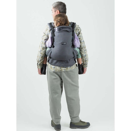 Isara The One - Graphite Linen baby carrier used by a parent carrying a toddler, perfect for family outings and durable comfort | Babymaxi