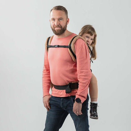 Isara The One - Macchiato baby carrier in use, supporting a child on the back for comfortable baby wearing | Babymaxi