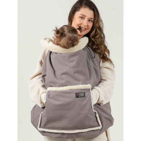 Isara Winter Baby Carrier Cover - Frosted Almond Taupe in use, keeping baby warm during colder months | Babymaxi