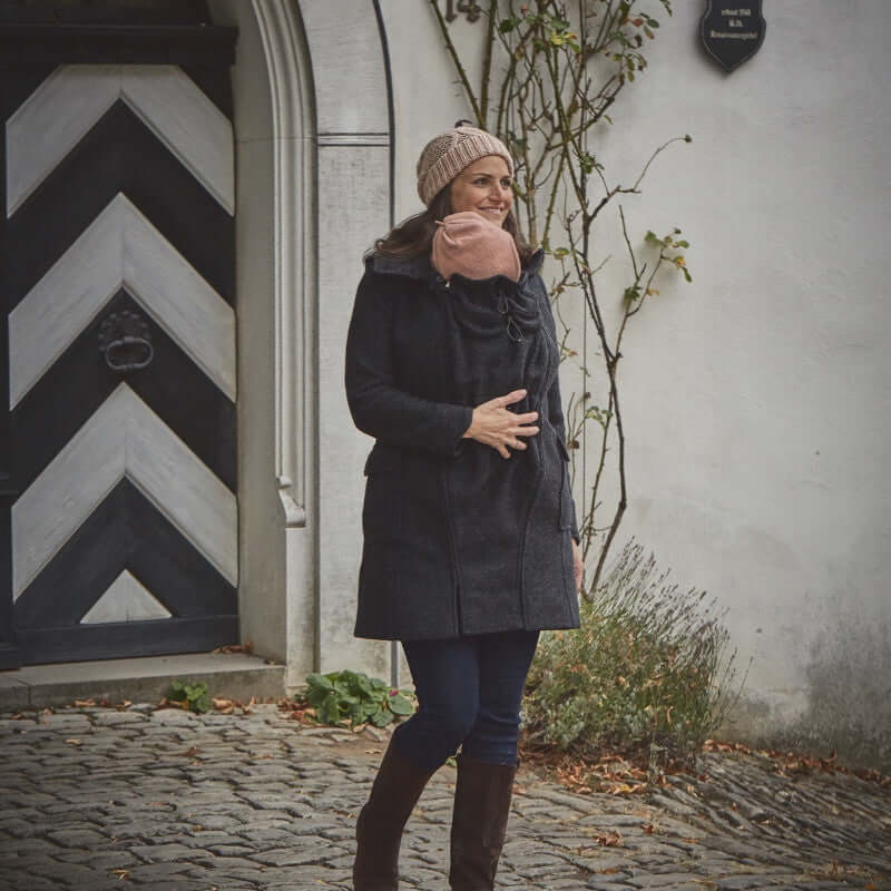 Mamalila Hooded Babywearing Coat Vienna - Anthracite worn by woman outdoors, featuring boiled wool, hood, and stylish design | Babymaxi