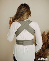 A woman wearing the Marsupi Breeze - Light Grey baby carrier from the back, showcasing its ergonomic design | Babymaxi