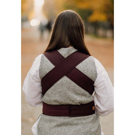 Woman wearing Marsupi Classic - Berry baby carrier, showcasing its stylish design and ergonomic fit | Babymaxi