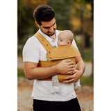 Marsupi Classic - Butterscotch baby carrier being used by a parent outdoors | Babymaxi