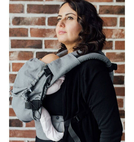 Neko Switch Baby Carrier - Bold, 2 extra hoods being used by a mother with baby against a brick background | Babymaxi