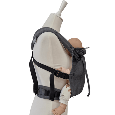 Stochenwiege Valeno Baby Carrier - Graphite on mannequin holding a baby doll, showcasing ergonomic design | Babymaxi