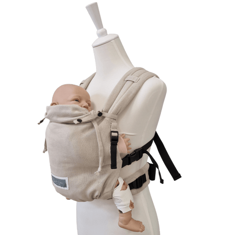 Stochenwiege Valeno Baby Carrier - Moonstone in use with a mannequin and baby doll | Babymaxi