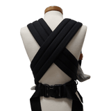 Back view of the Storchenwiege Talemo Half-Buckle Baby Carrier - Black showcasing the adjustable straps and buckle | Babymaxi