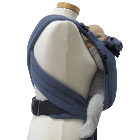 Storchenwiege Talemo Half-Buckle Baby Carrier - Denim displayed on a mannequin with a baby, showcasing its adjustable design | Babymaxi