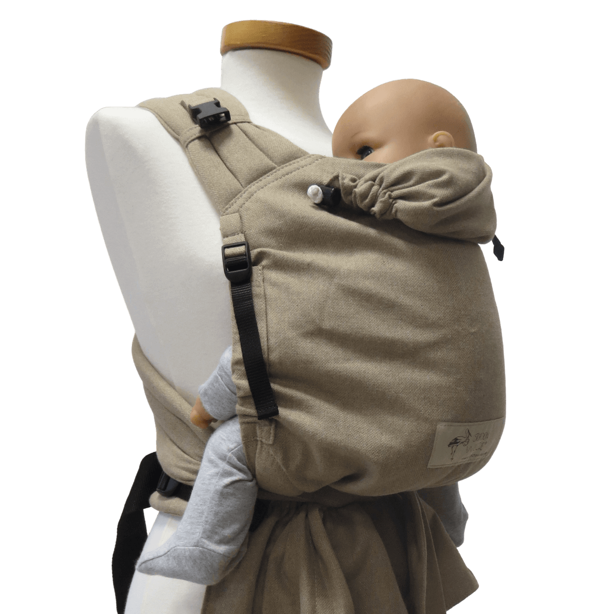 Storchenwiege Talemo Half-Buckle Baby Carrier - Sand on display with baby model | Babymaxi