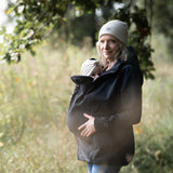 Mamalila Softshell Babywearing Jacket Allrounder Fit Black, mother carrying baby on front outdoors